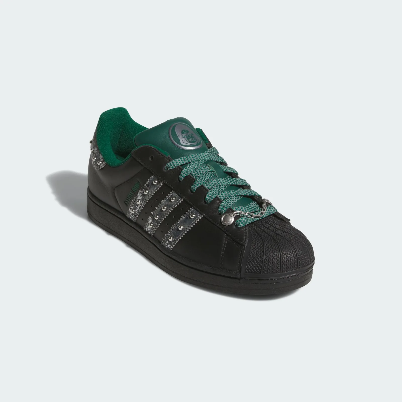 Front three-quarter view with green patterned laces and a silver lace chain, Doctor Doom