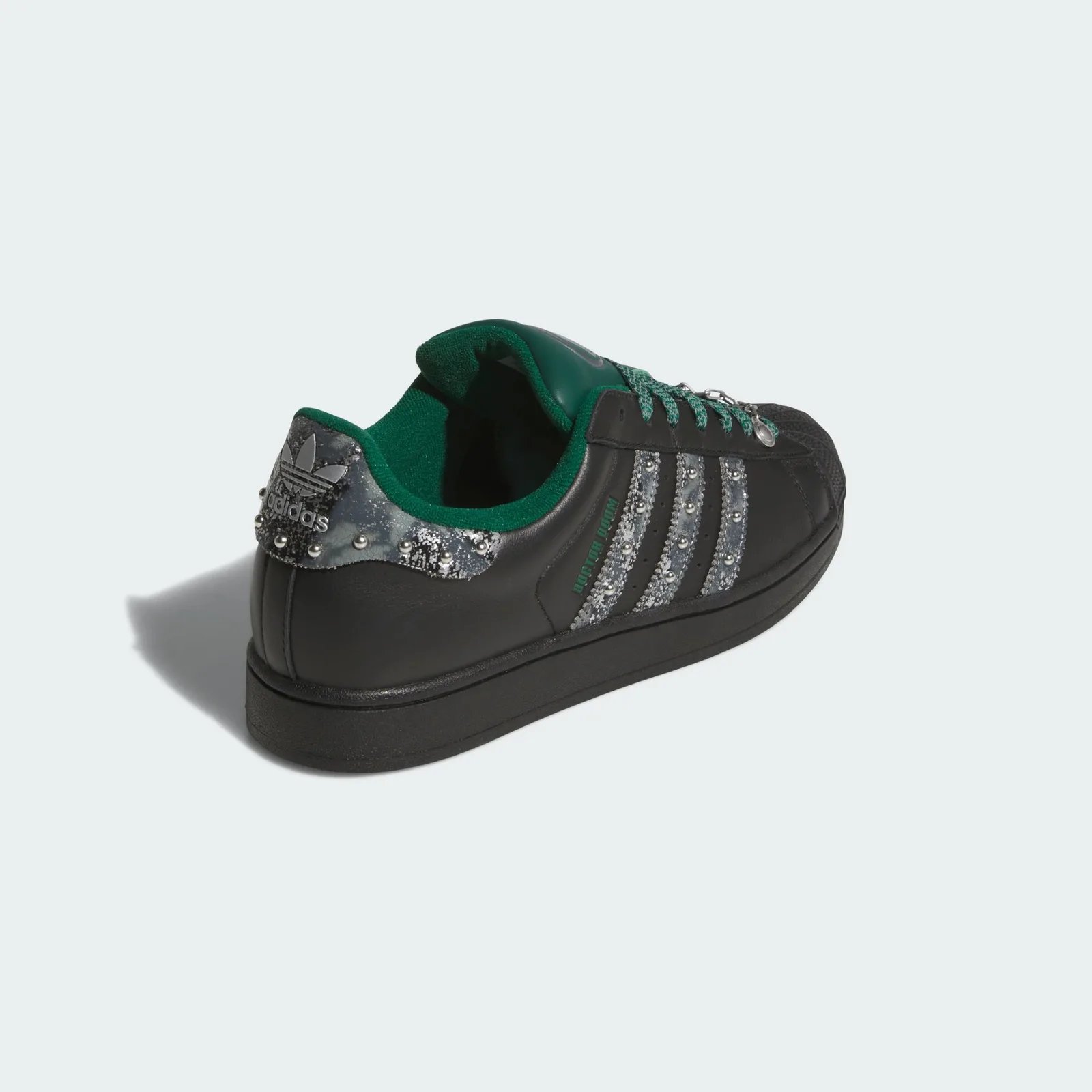 Rear three-quarter view with silver adidas heel logo and green collar, Doctor Doom
