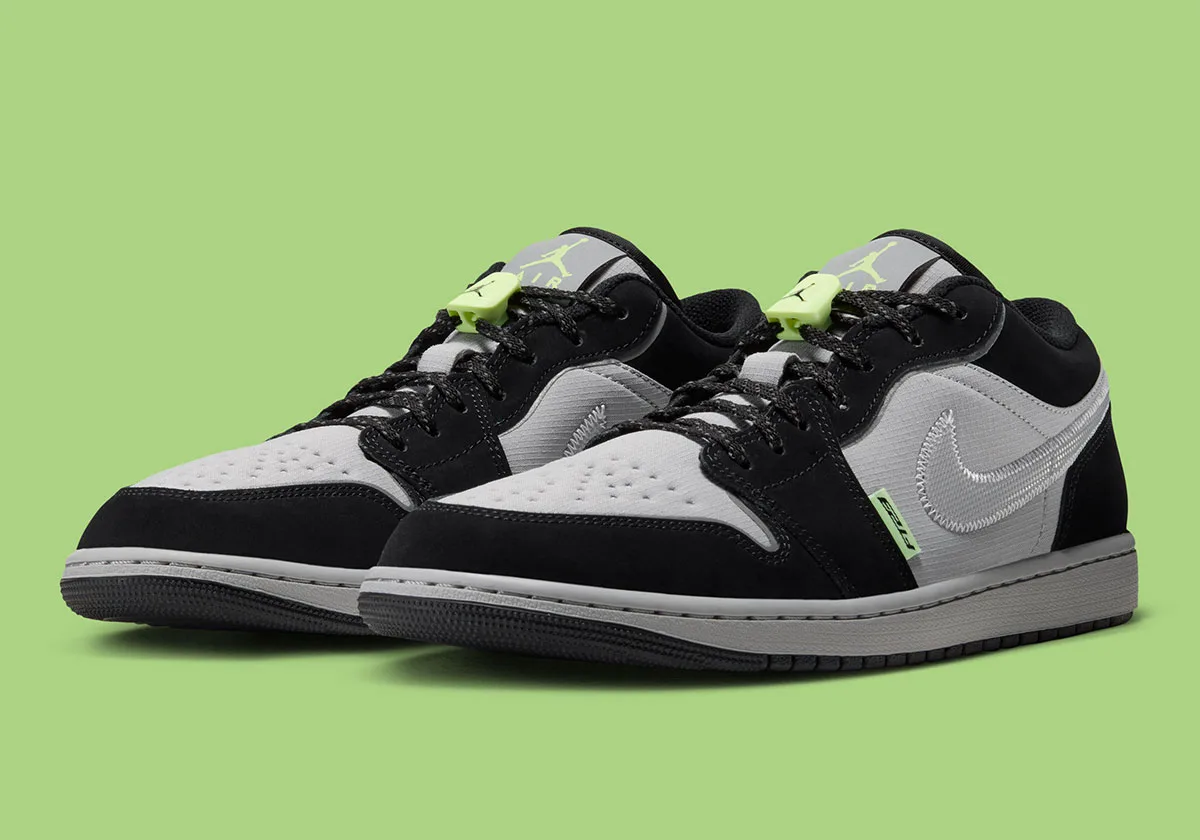 Pair at three-quarter angle, black and grey with neon green lace toggles and black speckled laces, Light Smoke Grey