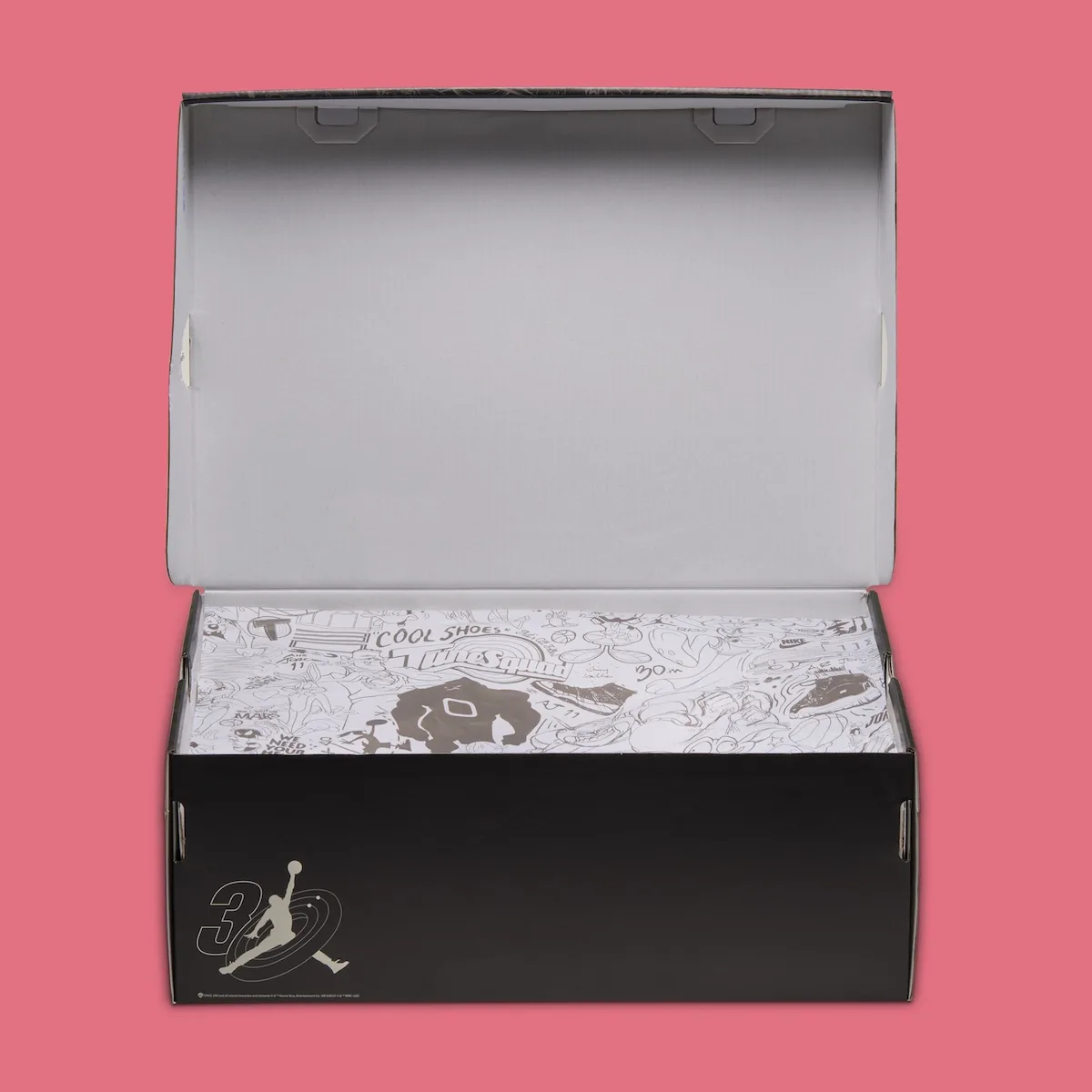 Open black shoe box with line-art doodle tissue paper and 30 Jumpman logo on the side, Lola Bunny