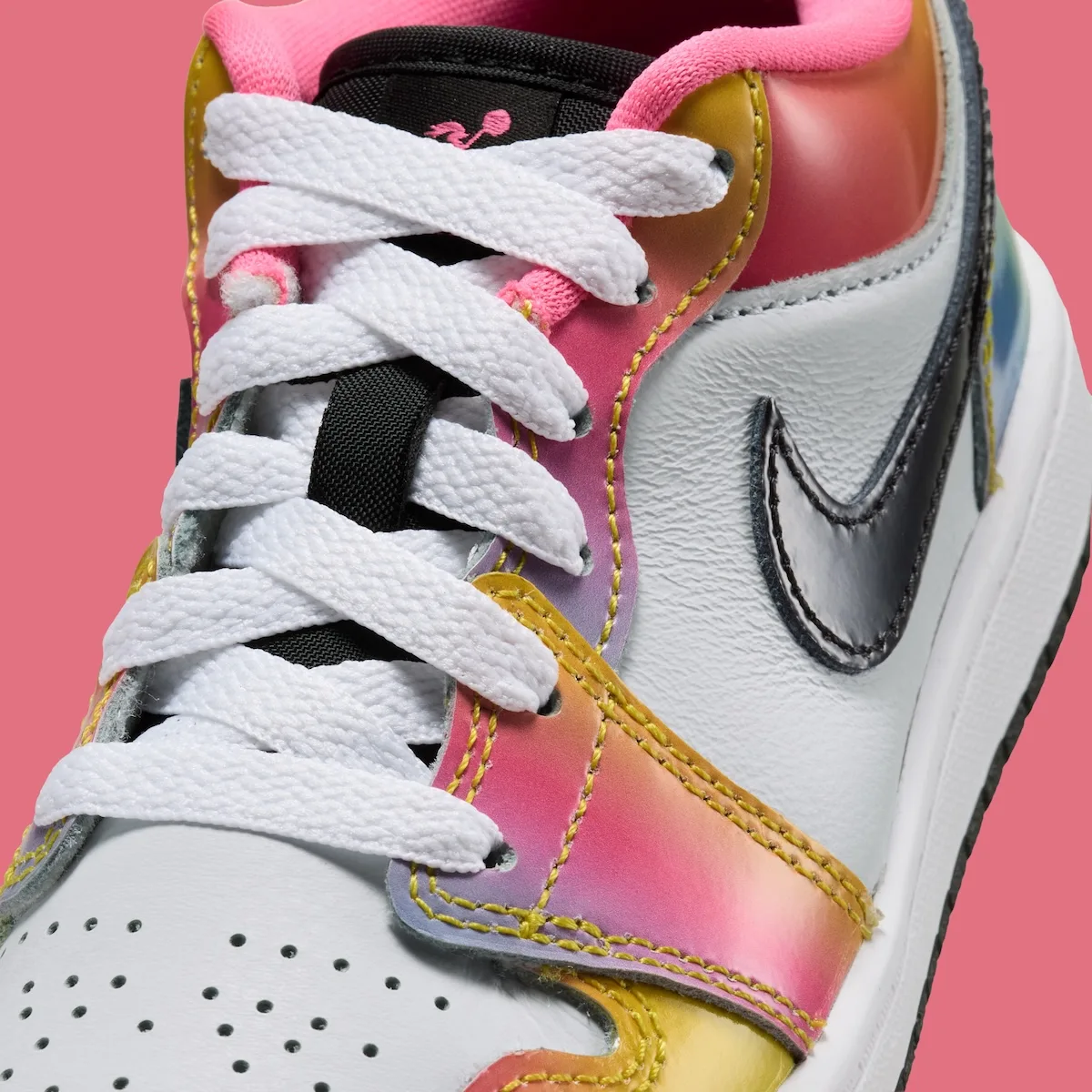 Detail of white laces, black patent swoosh, rainbow gradient overlays with yellow stitching, Lola Bunny