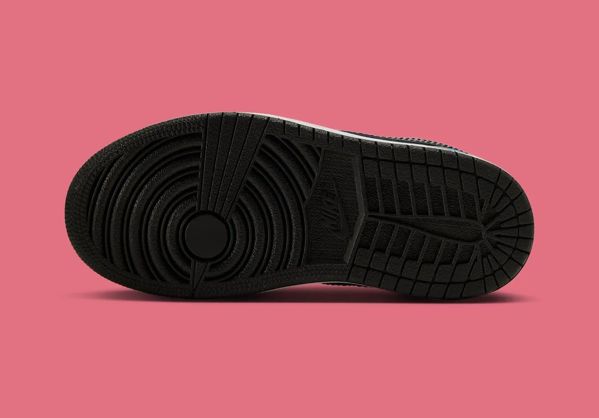 Outsole view on pink, black rubber with circular pivot pattern and small Nike logo, Lola Bunny