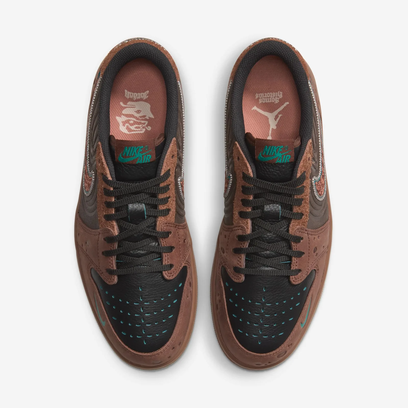 Top-down view of pair, black laces, teal perforated toe boxes, pink insoles with printed logos, Somos Historias