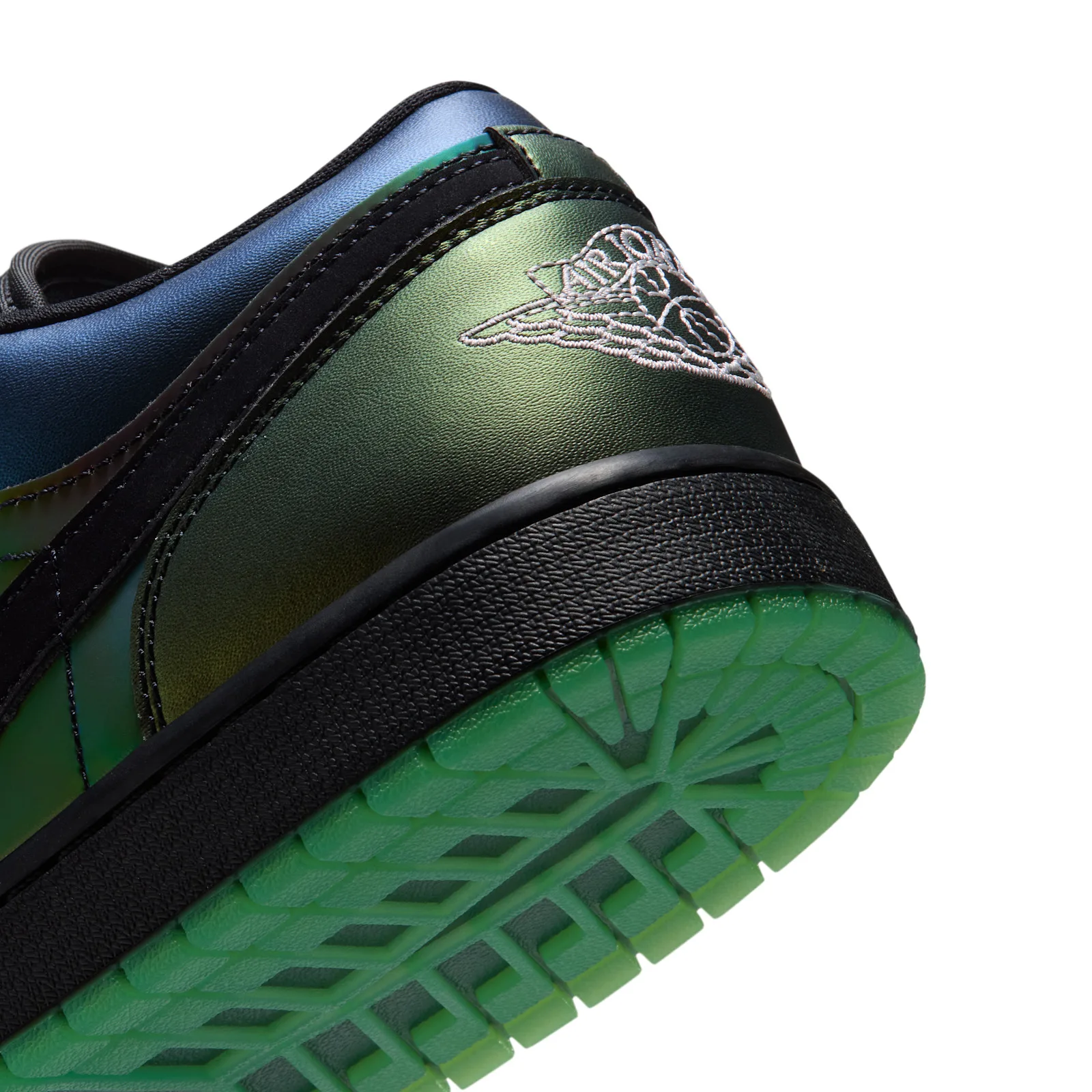 Detail of heel with stitched white wings logo, iridescent green-blue leather and green outsole, Air Bugs