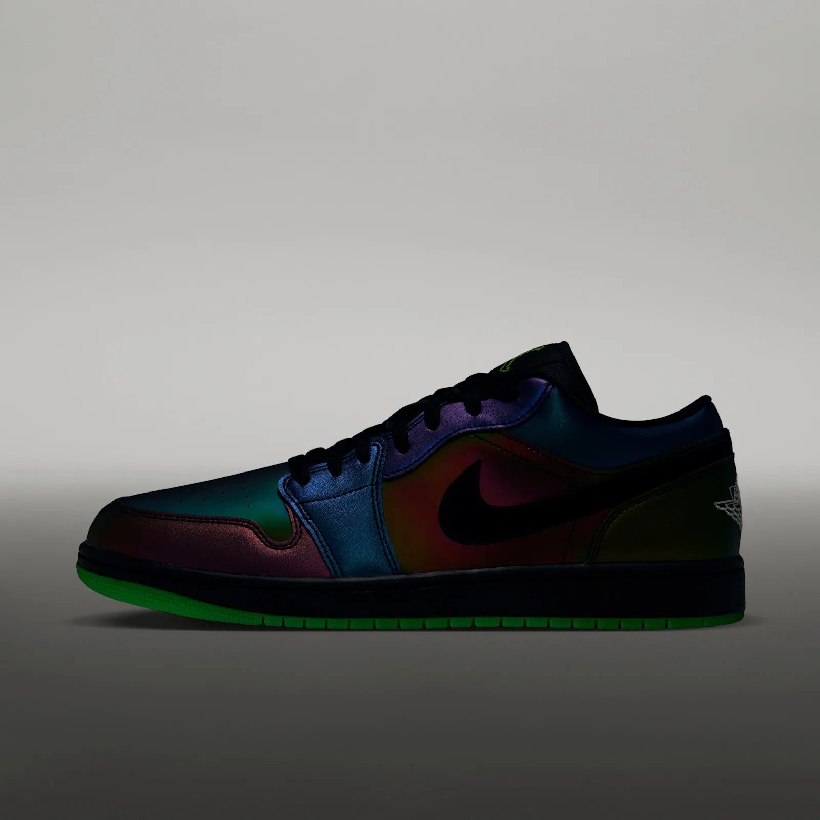 Lateral view on grey backdrop in low light, iridescent upper, black swoosh, bright green sole, Air Bugs
