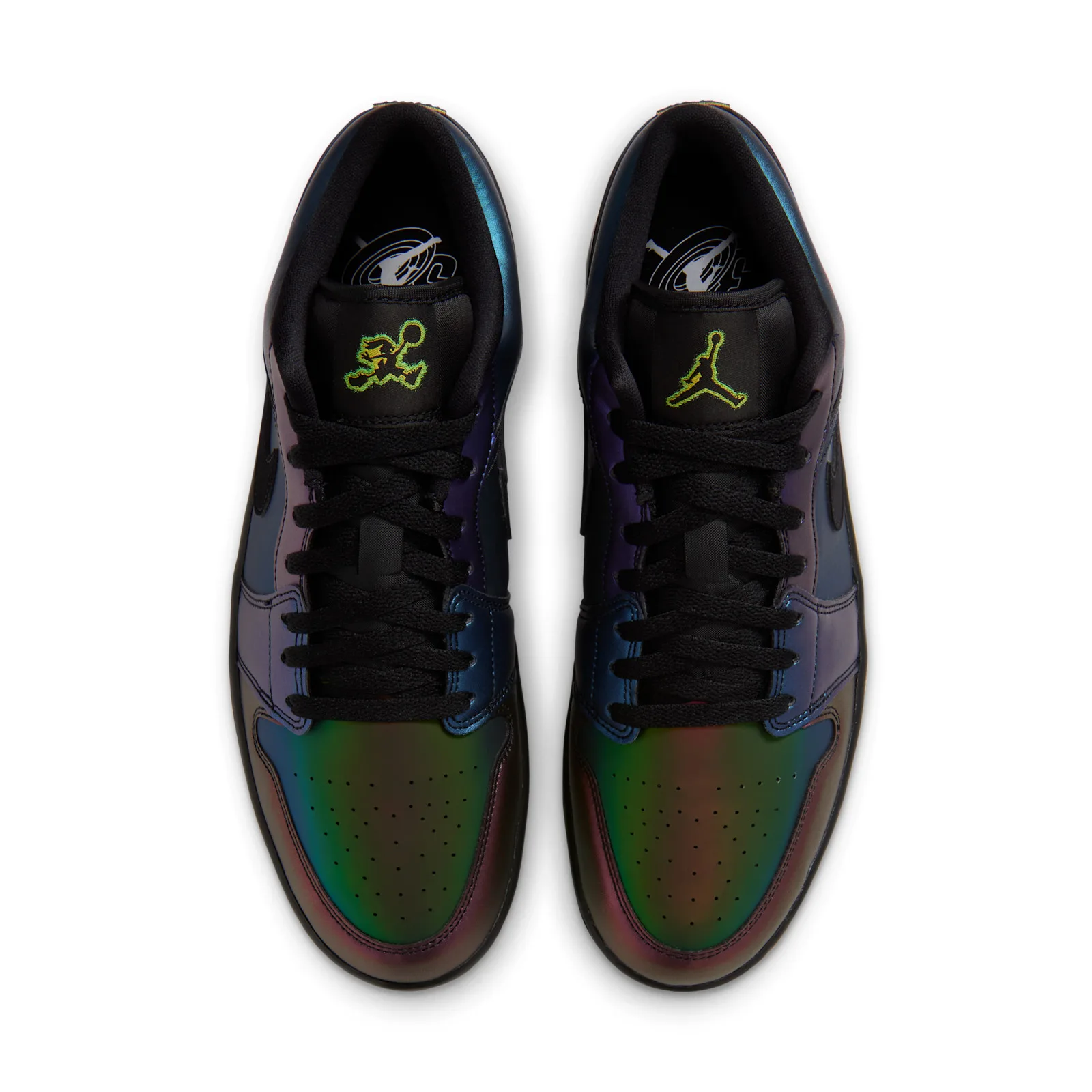 Top-down view of pair with black laces, neon green Jumpman tongue labels, iridescent toe boxes, Air Bugs