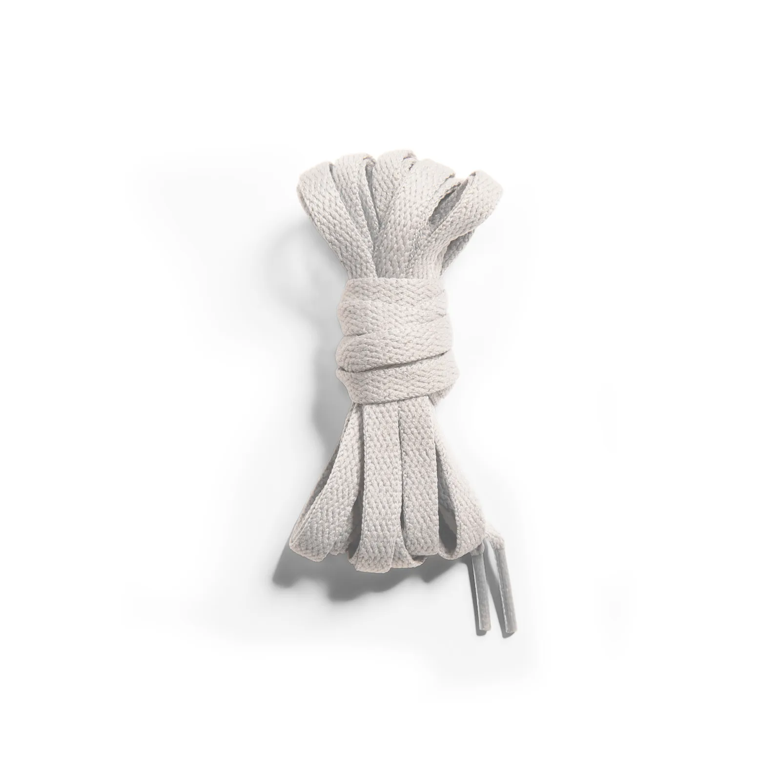 Bundle of flat cream laces tied together with plastic tips on white background, Dia de Los Muertos