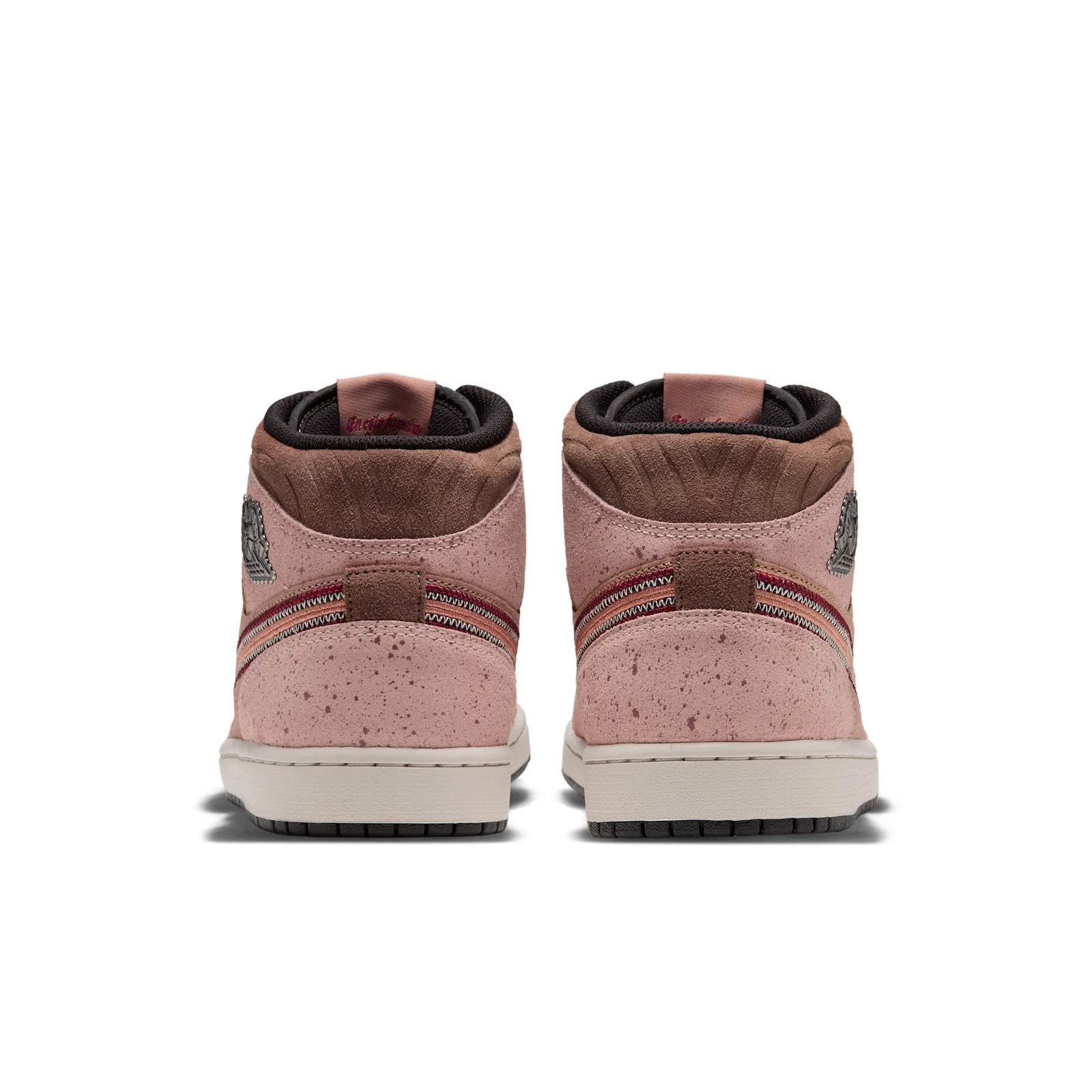 Heel view of pair, speckled pink suede, stitched swoosh edges, brown collar, cream midsole, Dia de Los Muertos