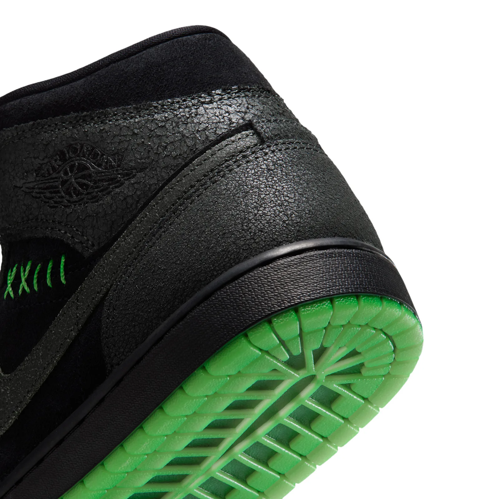 Heel detail with cracked dark overlays, Wings logo and green outsole, Halloween