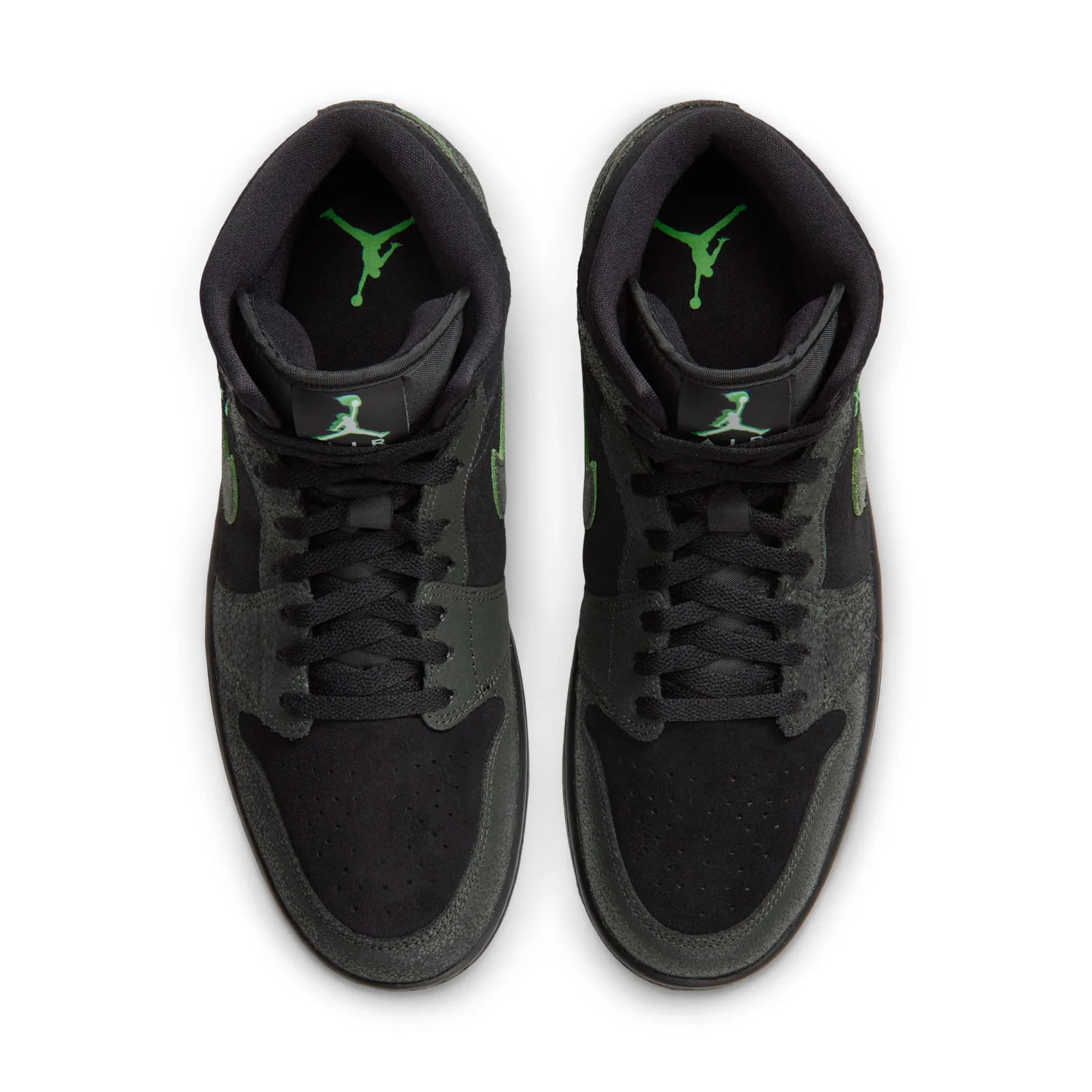 Top-down view of pair with black laces and green Jumpman insole logos, Halloween