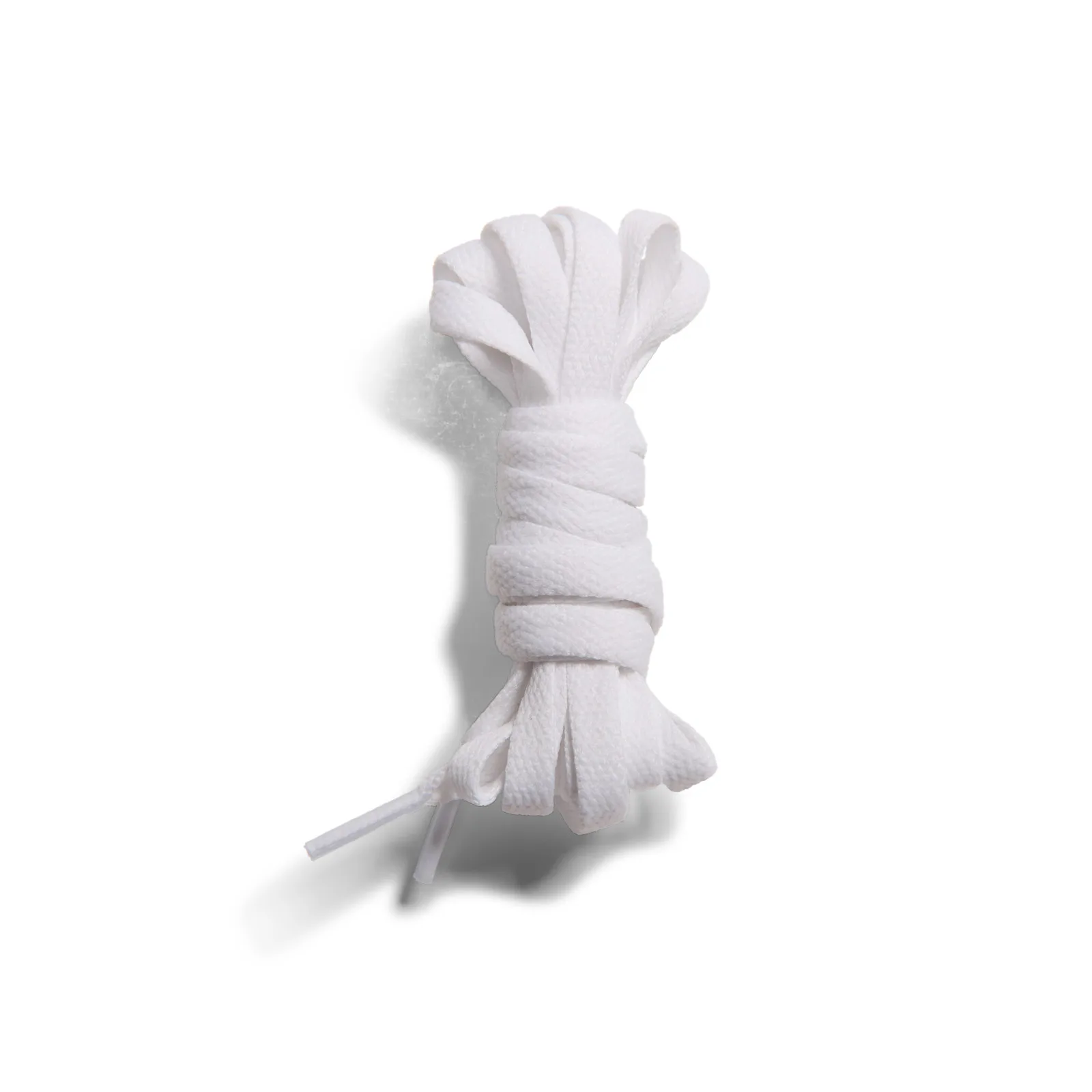 Coiled flat white laces on white background, packaged-style product shot, Knicks