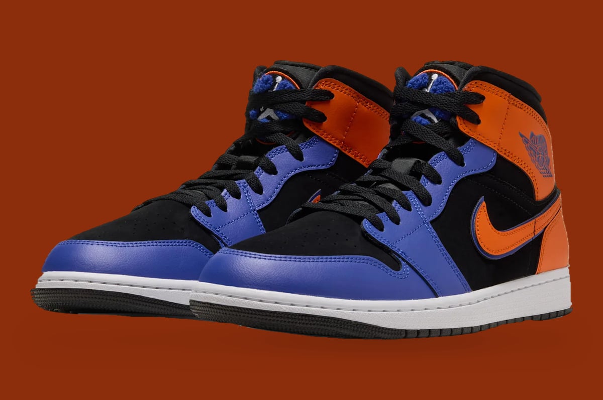 Pair, front three-quarter view, black laces, blue toe boxes and orange collars, Knicks
