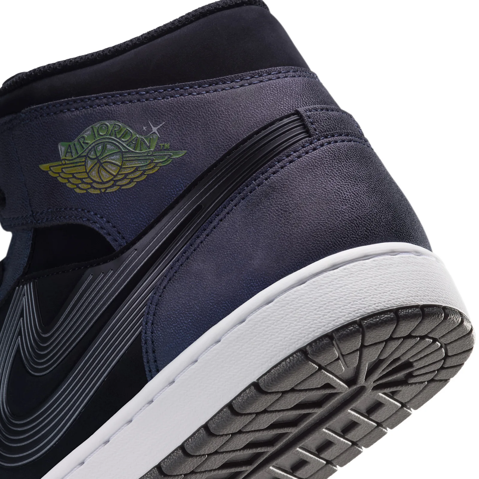 Detail of heel, green-yellow Air Jordan wings logo, ridged black swoosh, white midsole, grey outsole, Air Bugs