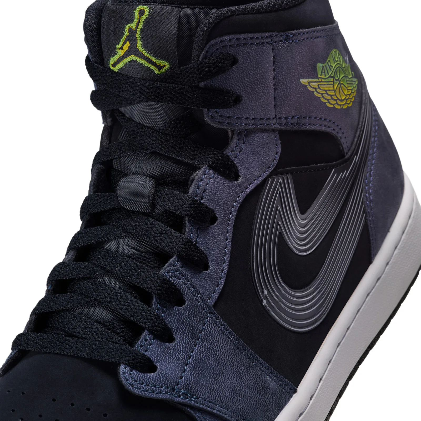 Detail of lateral side, ridged grey swoosh, black laces, green wings logo and tongue jumpman, Air Bugs
