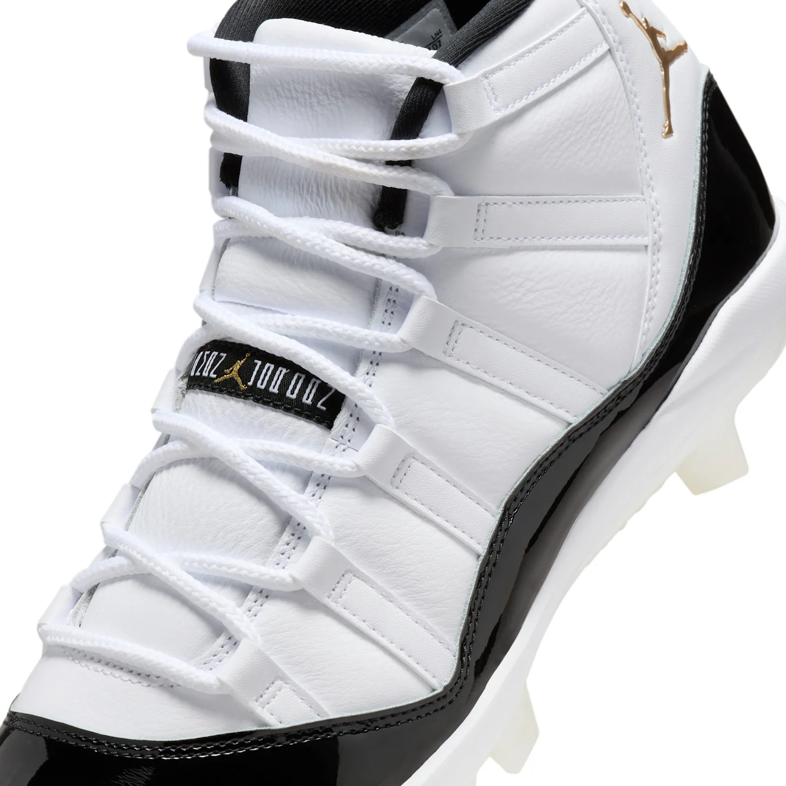 Detail of laces and tongue, white leather, black tongue label with gold Jumpman, black patent toe, DMP