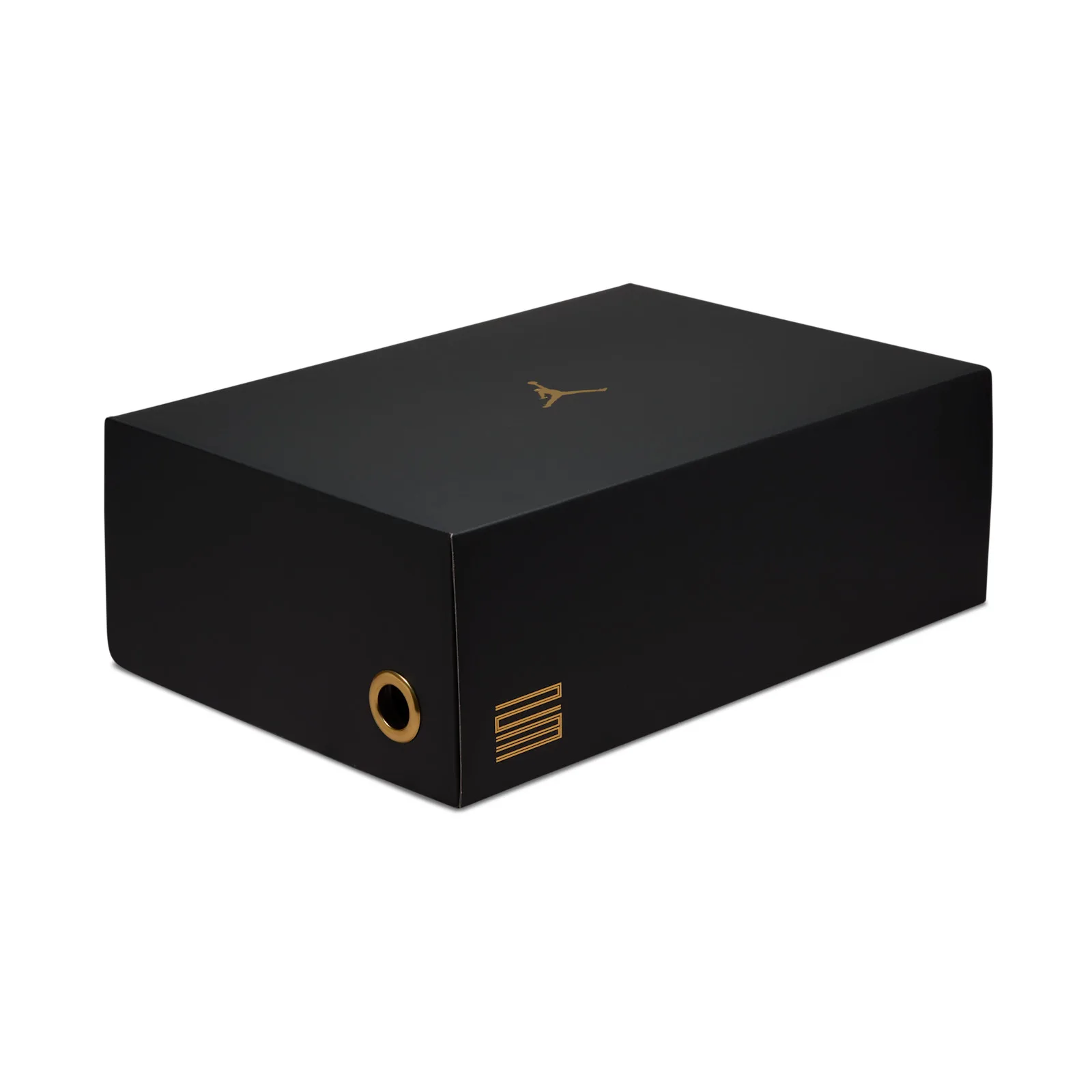 Black shoebox at an angle, gold Jumpman on lid, gold eyelet and gold 11 logo on end, DMP