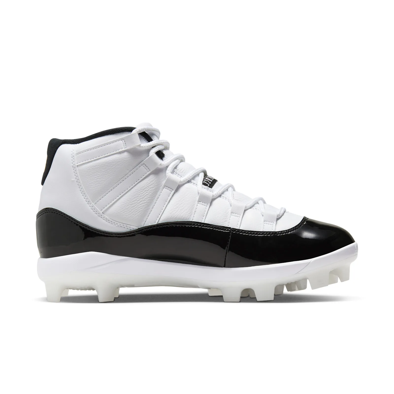 Medial view of white leather cleat with glossy black patent toe, white laces and white studded sole, DMP