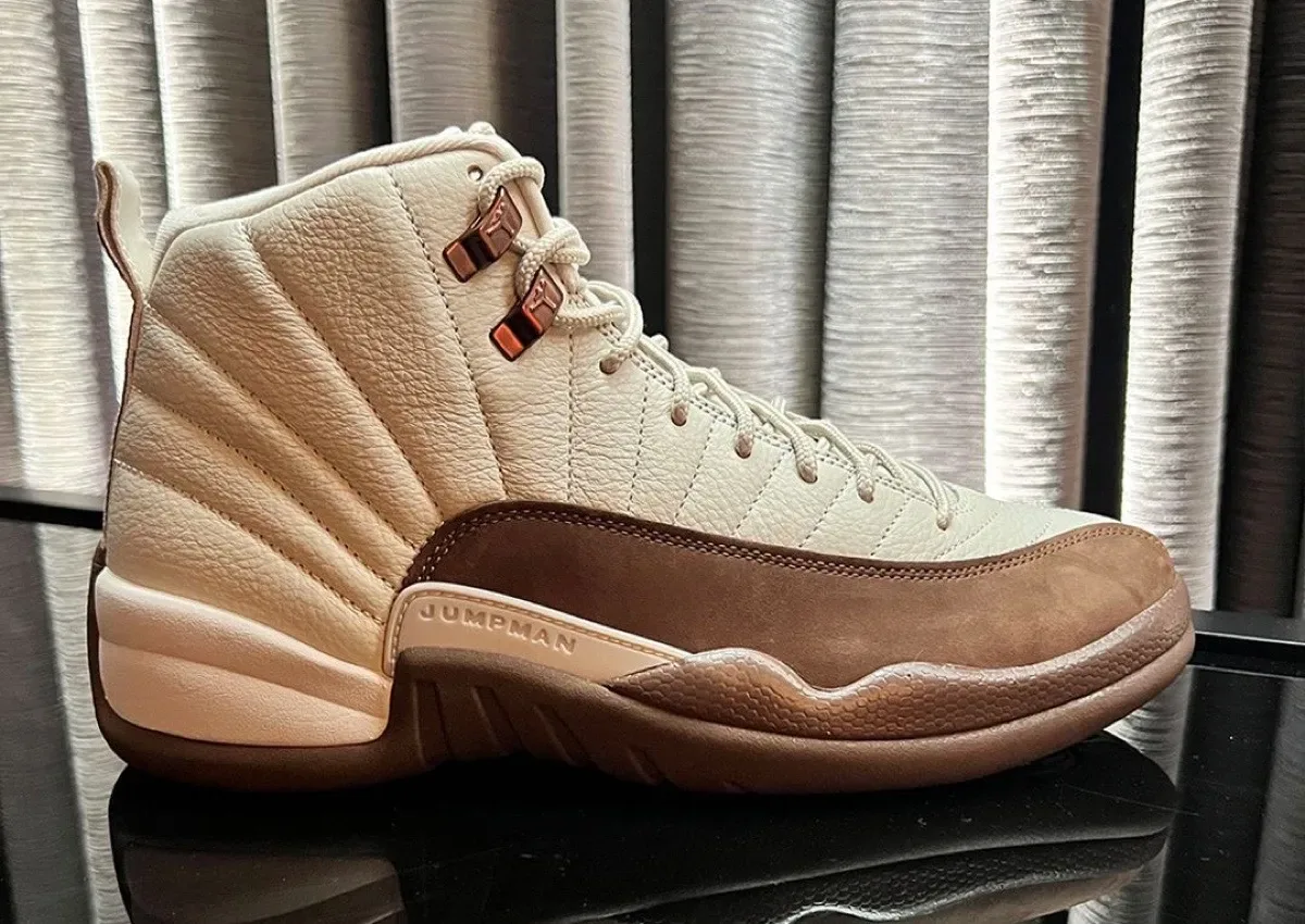 lateral view on glass surface, cream leather with bronze Jumpman eyelet tabs, Fireside
