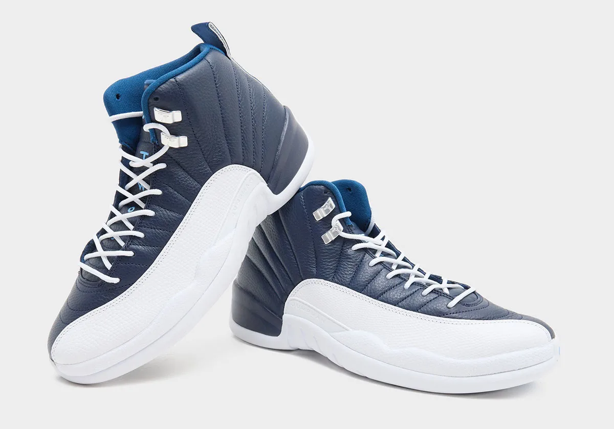 Pair angled together, navy panels, white laces, white midsole and silver lace hardware, Obsidian