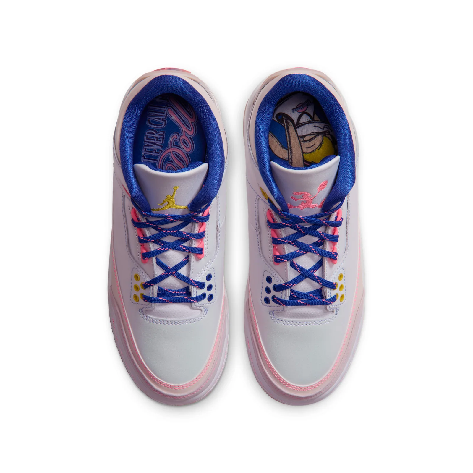 Top-down view of pair, blue laces with pink flecks, yellow Jumpman and pink bunny on tongues, cartoon insoles visible, Lola