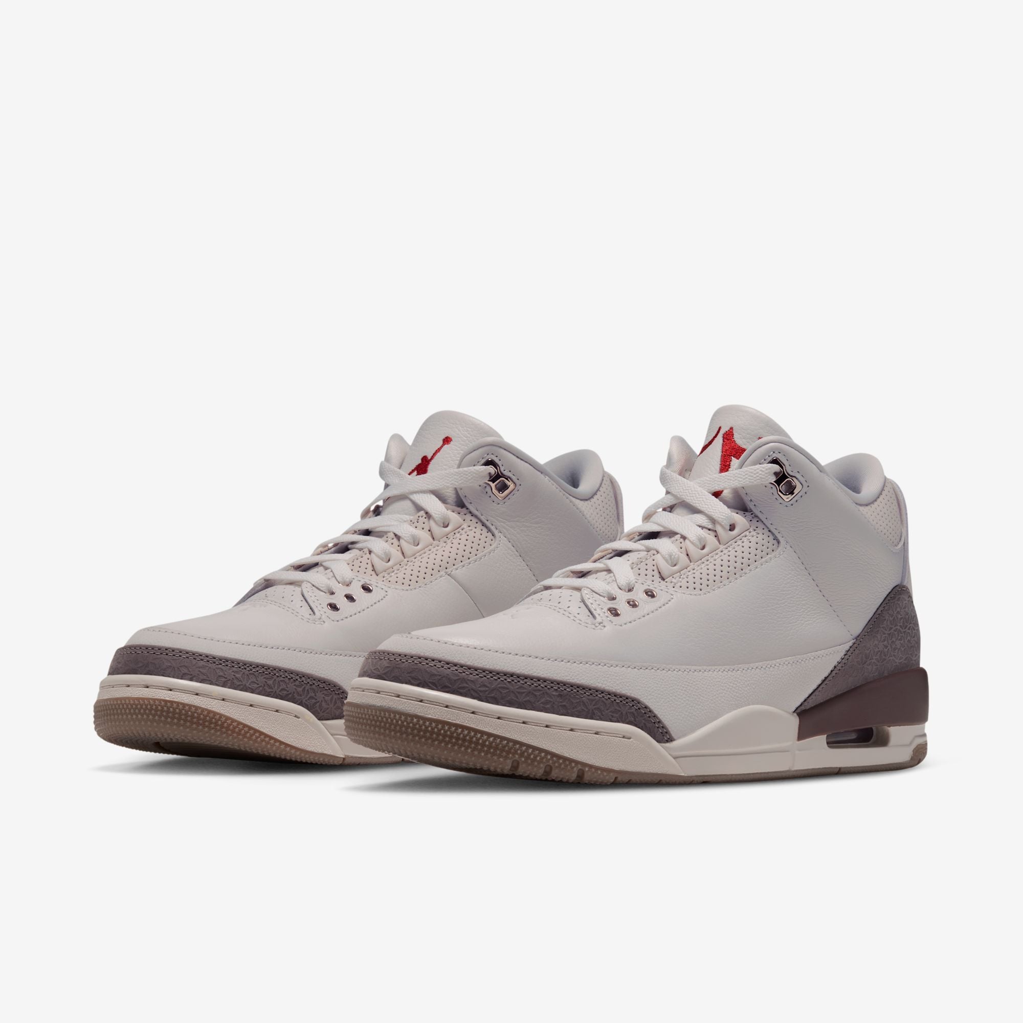 three-quarter front pair view, grey leather with mauve toe caps and gum-edged soles, Middle East