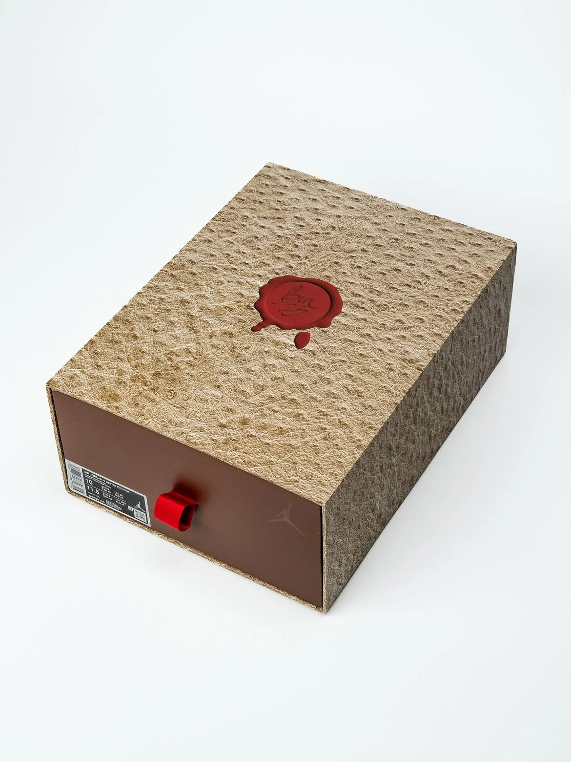 Packaging, tan ostrich-textured box with red wax seal, brown drawer, red ribbon pull, Bin23