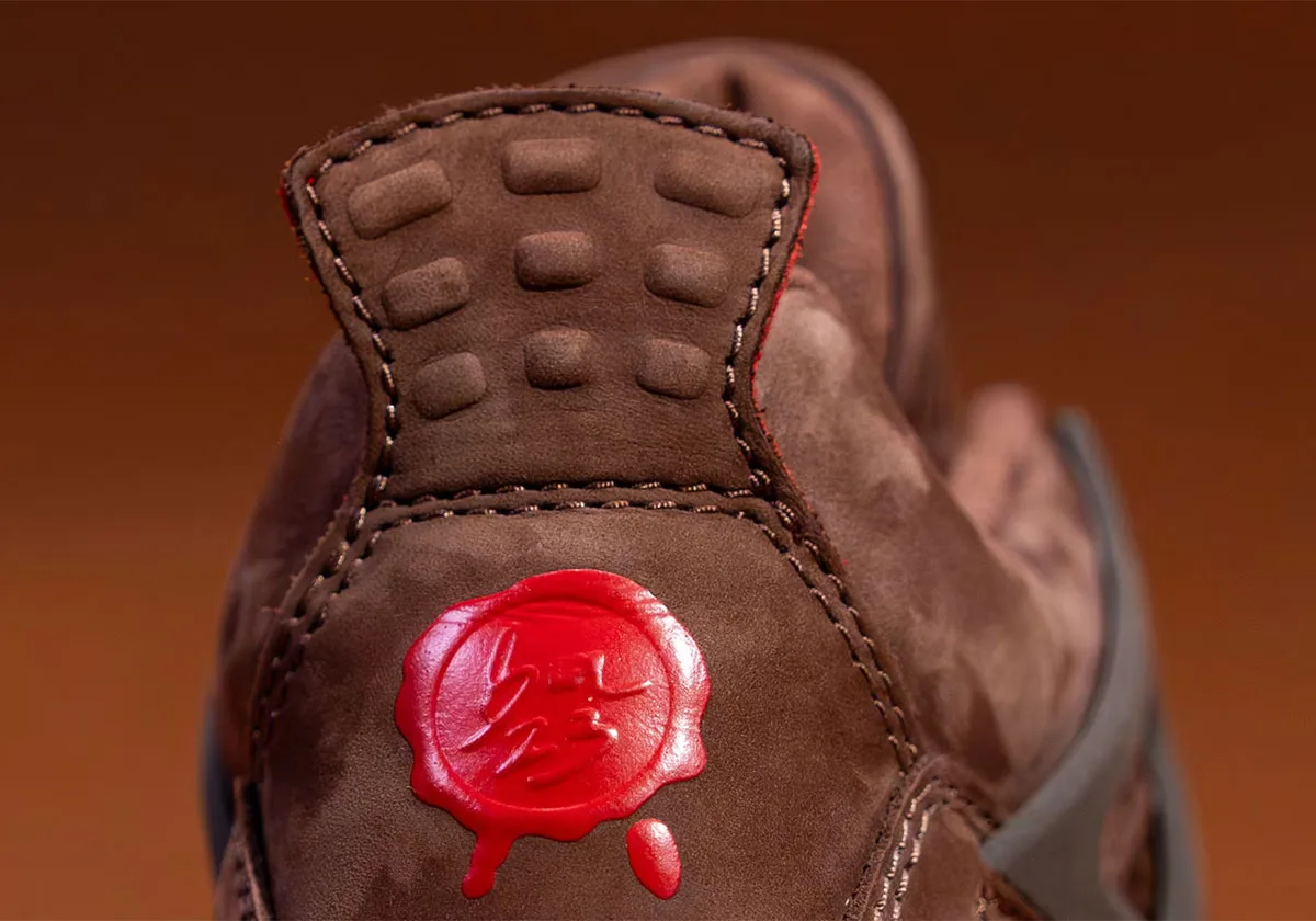 Heel detail, brown nubuck pull tab with raised nodes and red wax seal with drip, Bin23