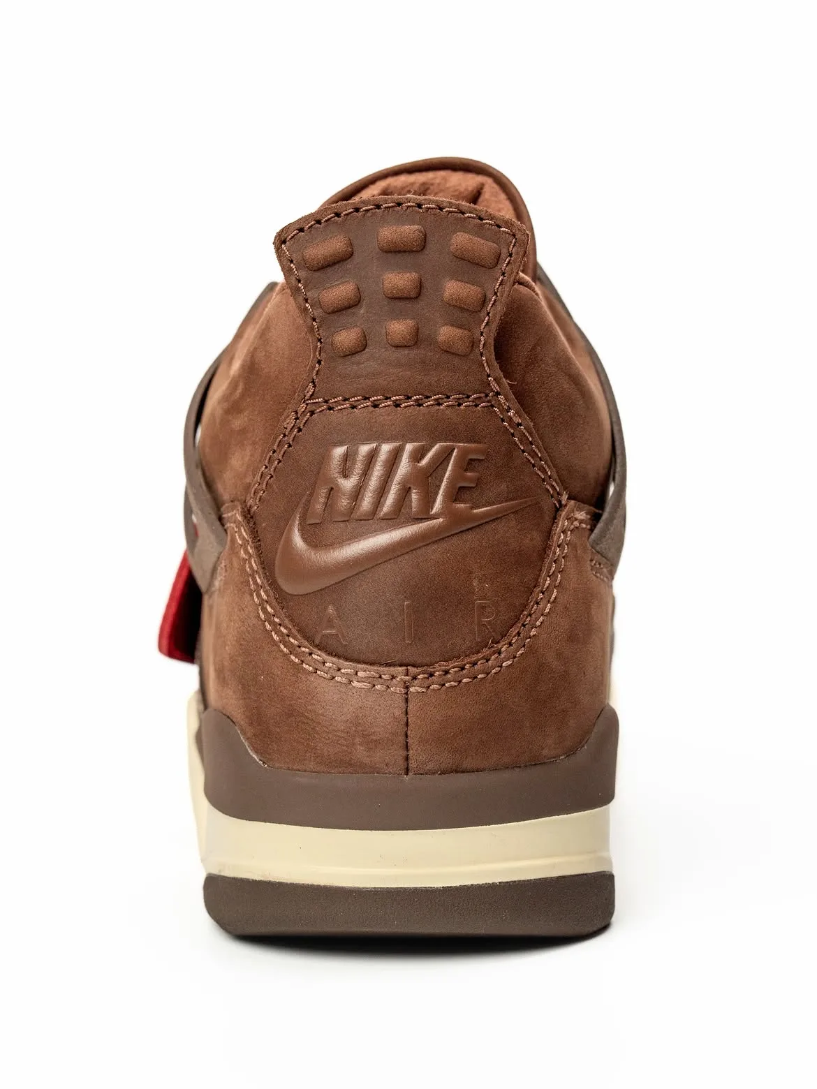 Heel view, embossed Nike Air logo on brown nubuck, red pull tab and cream midsole, Bin23