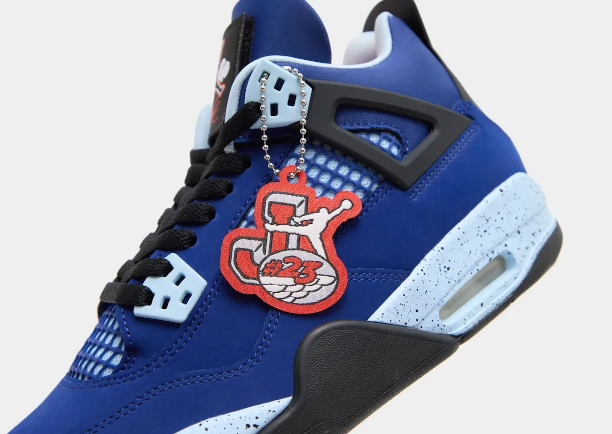 Close detail of red #23 hang tag on blue upper with speckled light blue midsole, Deep Royal Blue