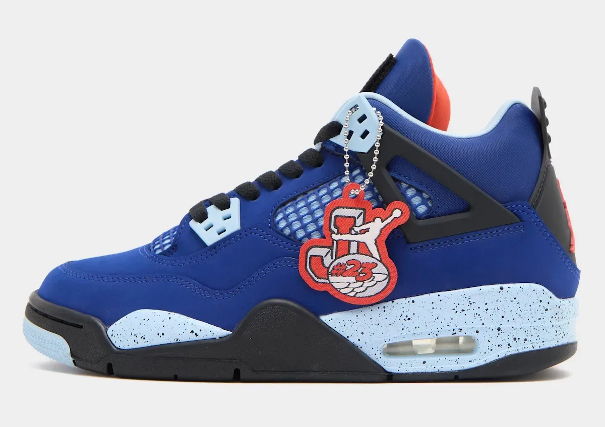Lateral view of blue shoe with speckled light blue midsole and red #23 tag, Deep Royal Blue