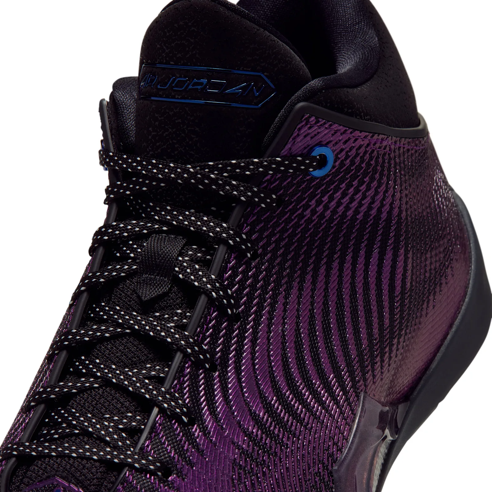 Detail of laces and tongue, white-flecked black laces, blue Air Jordan tongue logo, Amethyst