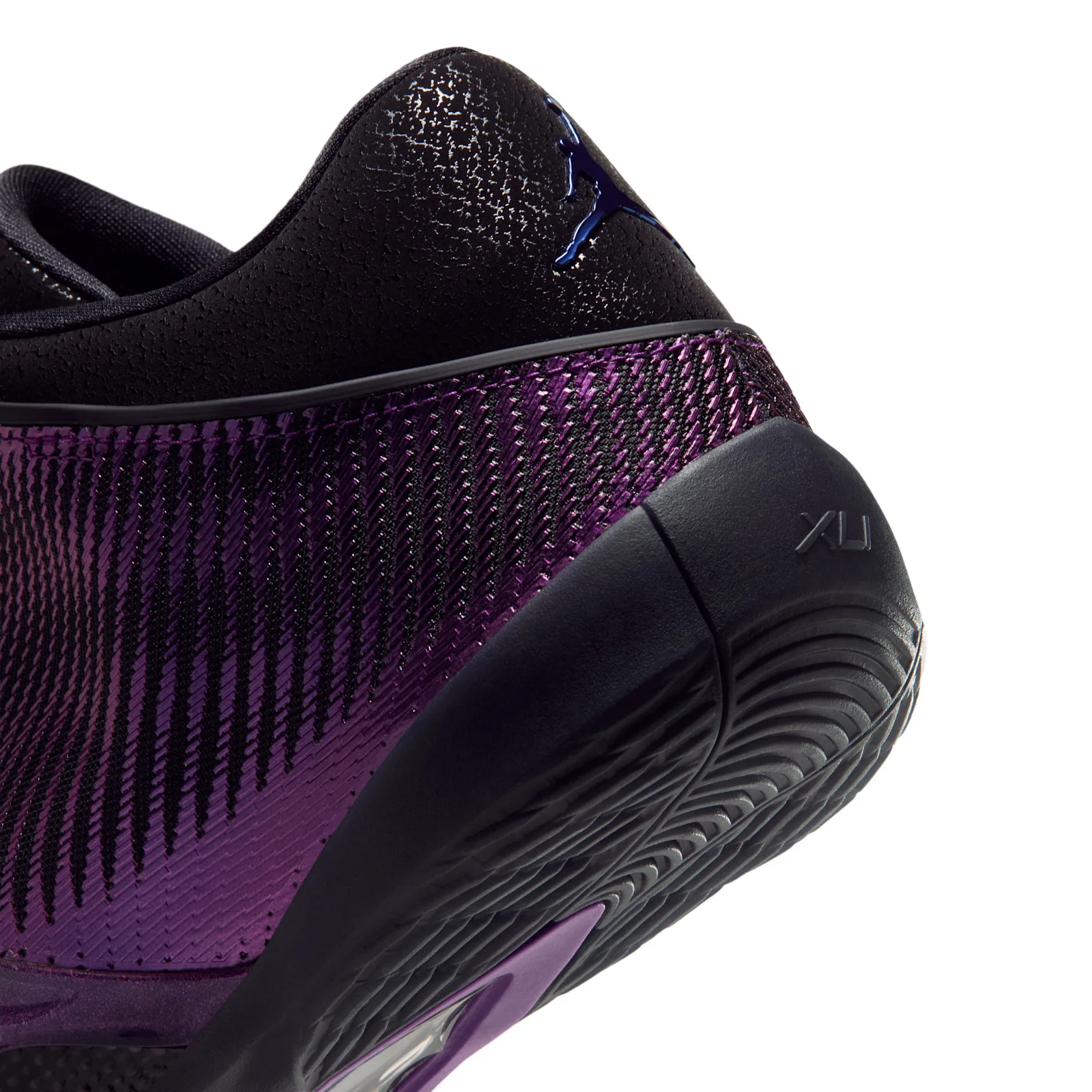 Detail of heel, blue Jumpman on black textured collar, XLI on black midsole, Amethyst