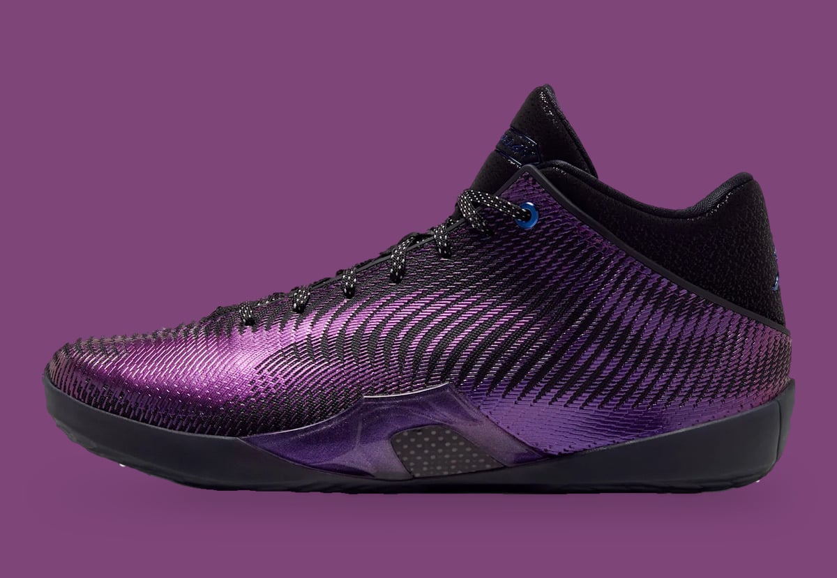 Lateral view, shimmering purple woven upper, black collar, blue eyelet, purple backdrop, Amethyst