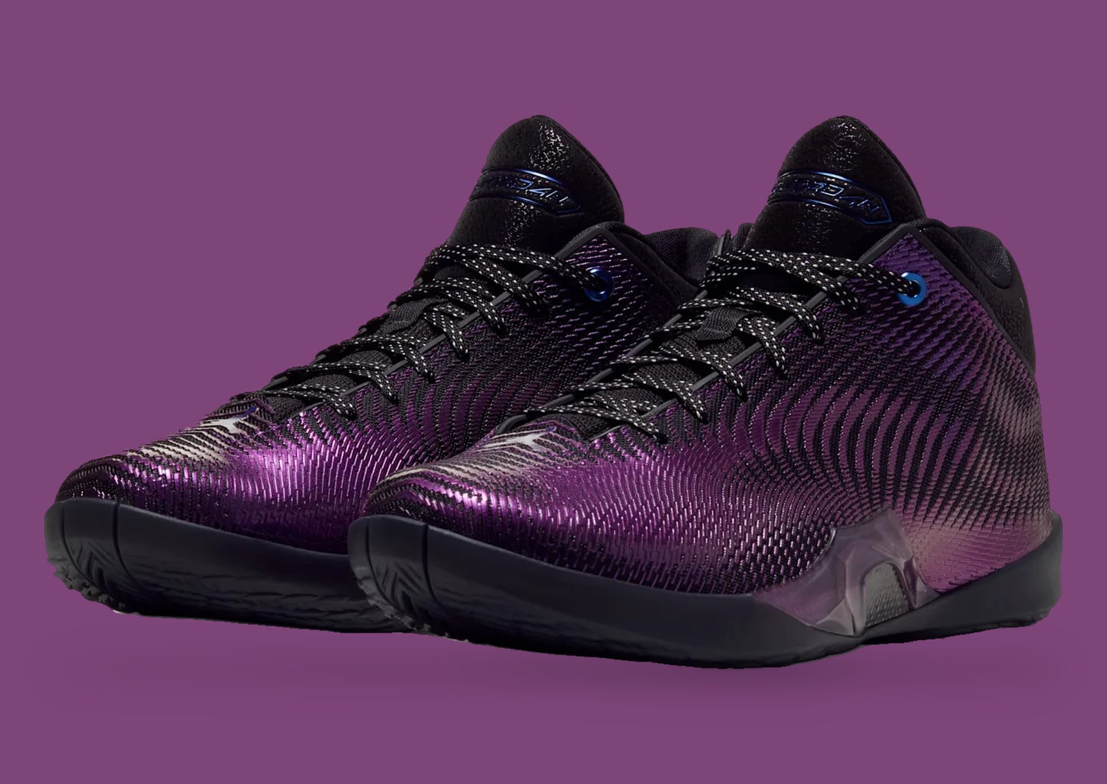 Pair, front three-quarter view, iridescent purple-black woven uppers on a purple backdrop, Air Jordan 41 PF “Amethyst”