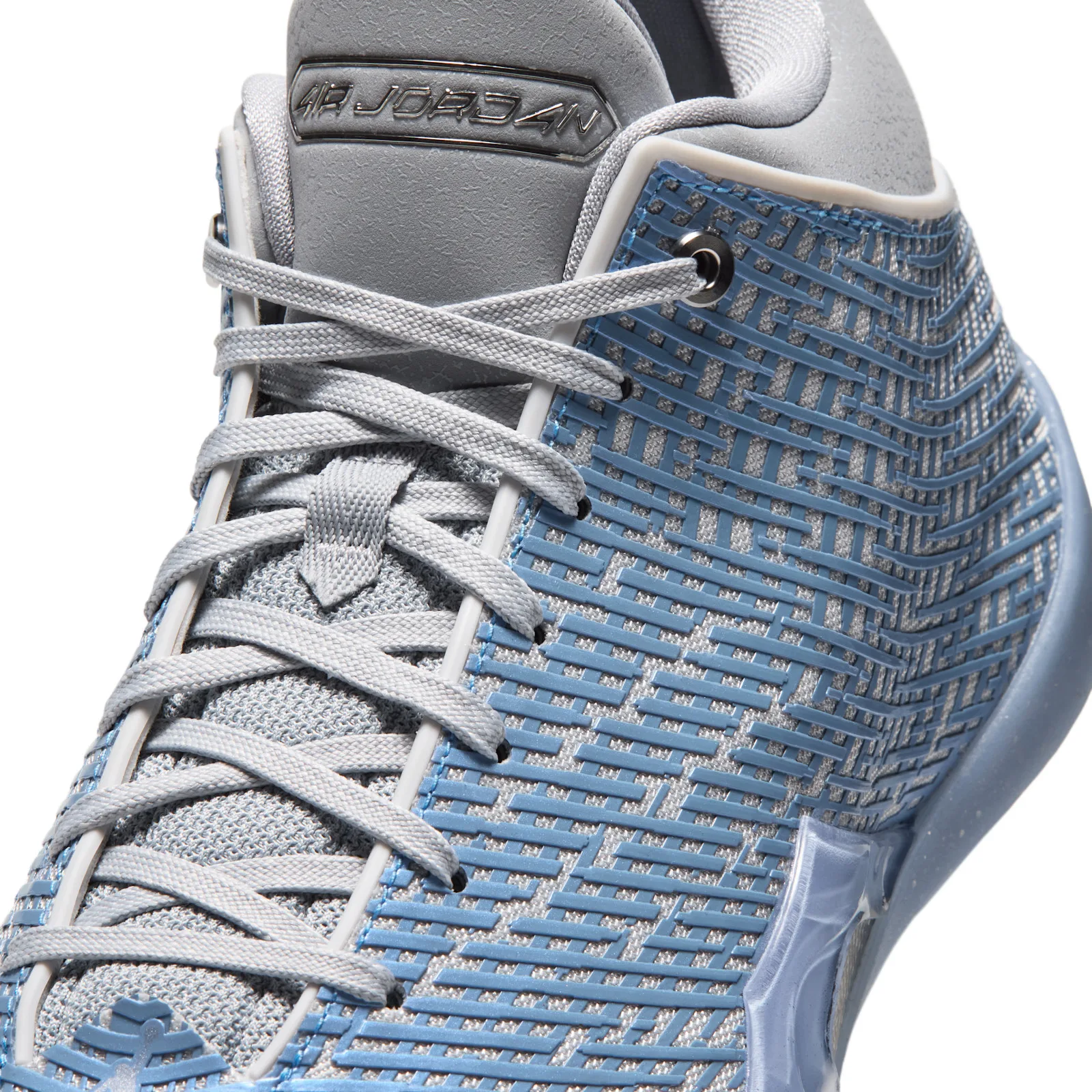 Detail of the laces and collar with a chrome Air Jordan badge, light blue maze-pattern upper, Space Jam