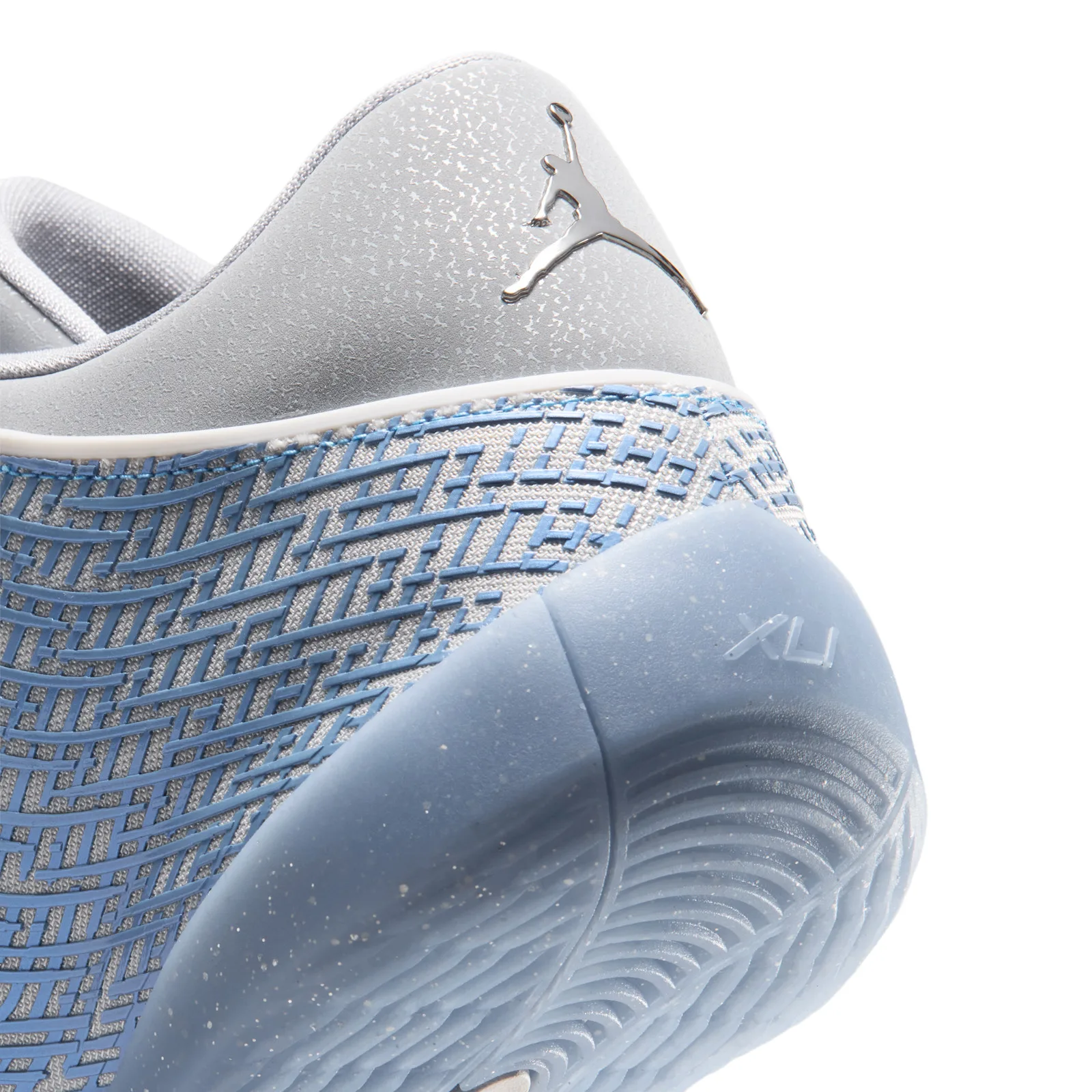 Detail of the heel with a silver Jumpman logo, light blue maze pattern, speckled sole with XLI, Space Jam