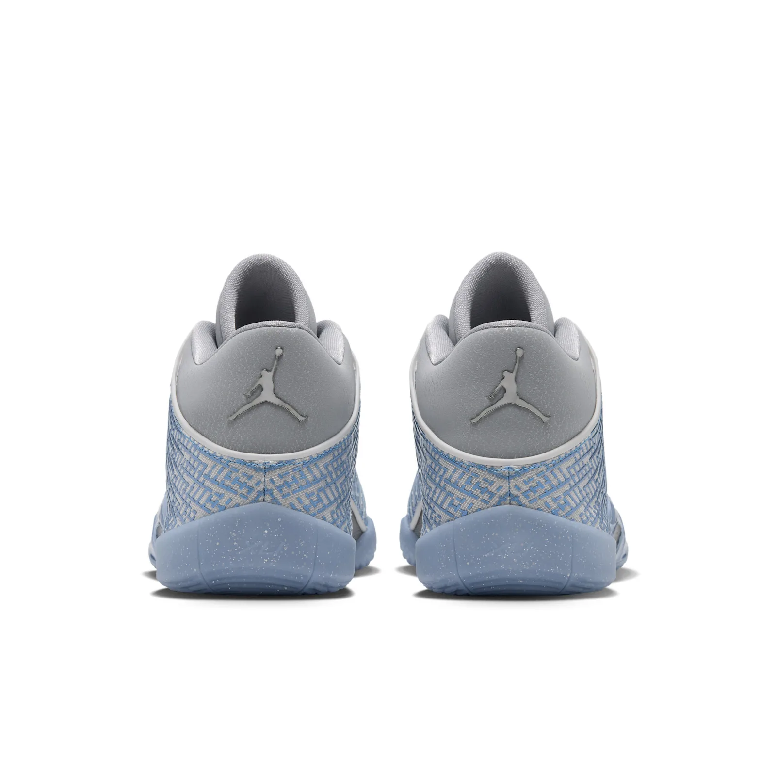 Heel view of the pair with silver Jumpman logos on grey heel tabs, light blue maze pattern, Space Jam
