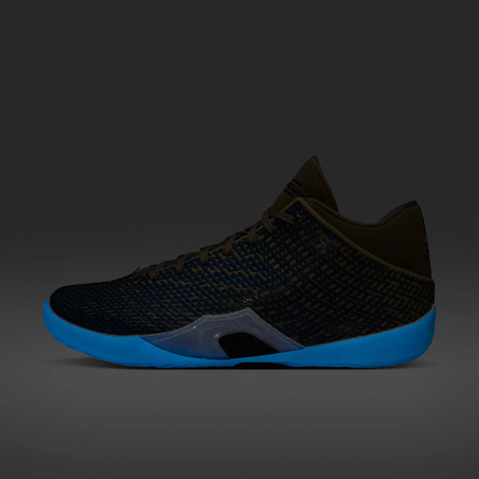 Lateral view in dark glow state, blue sole glowing against a dark upper on a grey background, Space Jam