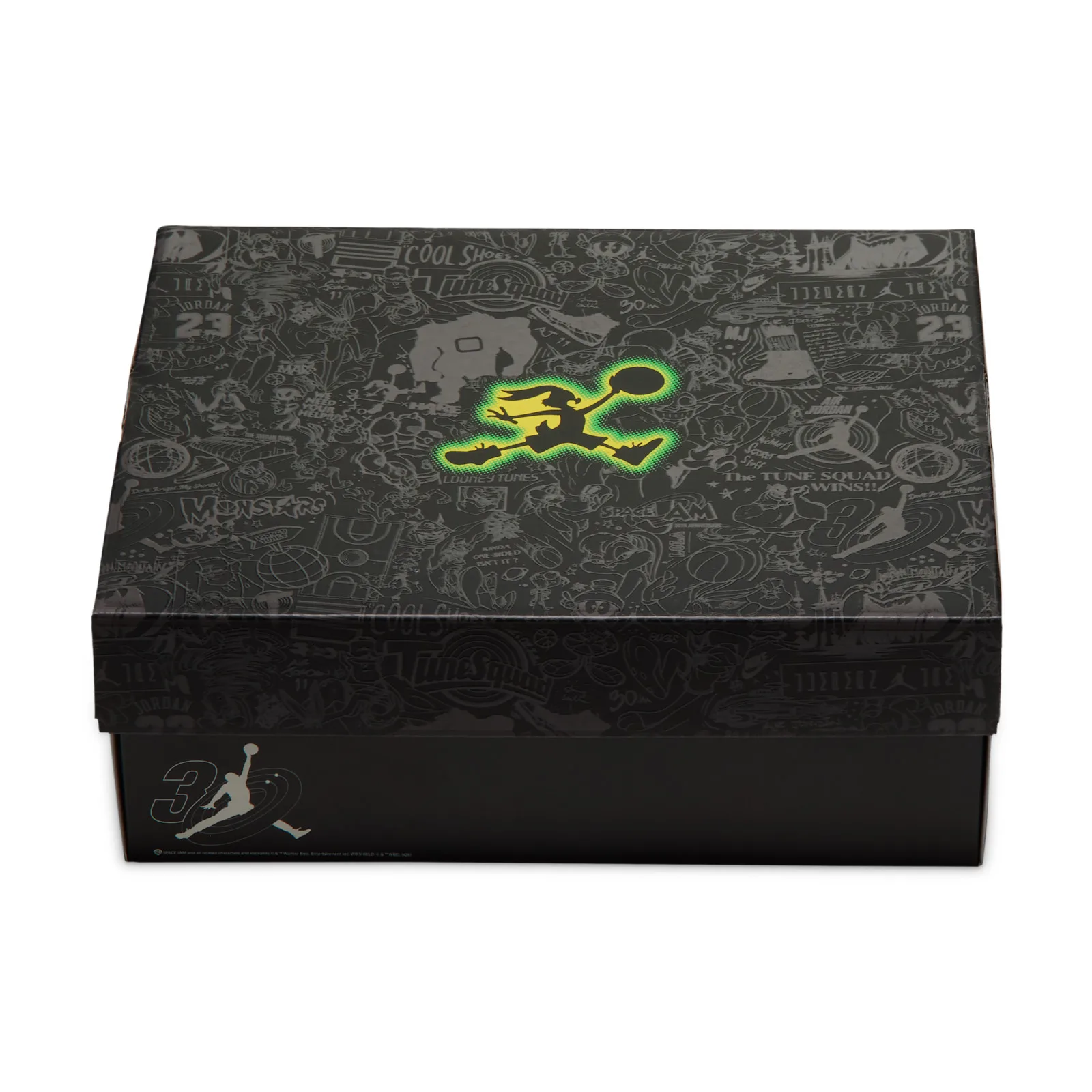 Closed black shoebox with embossed cartoon pattern and glowing green and yellow Jumpman, Space Jam Amusement Park