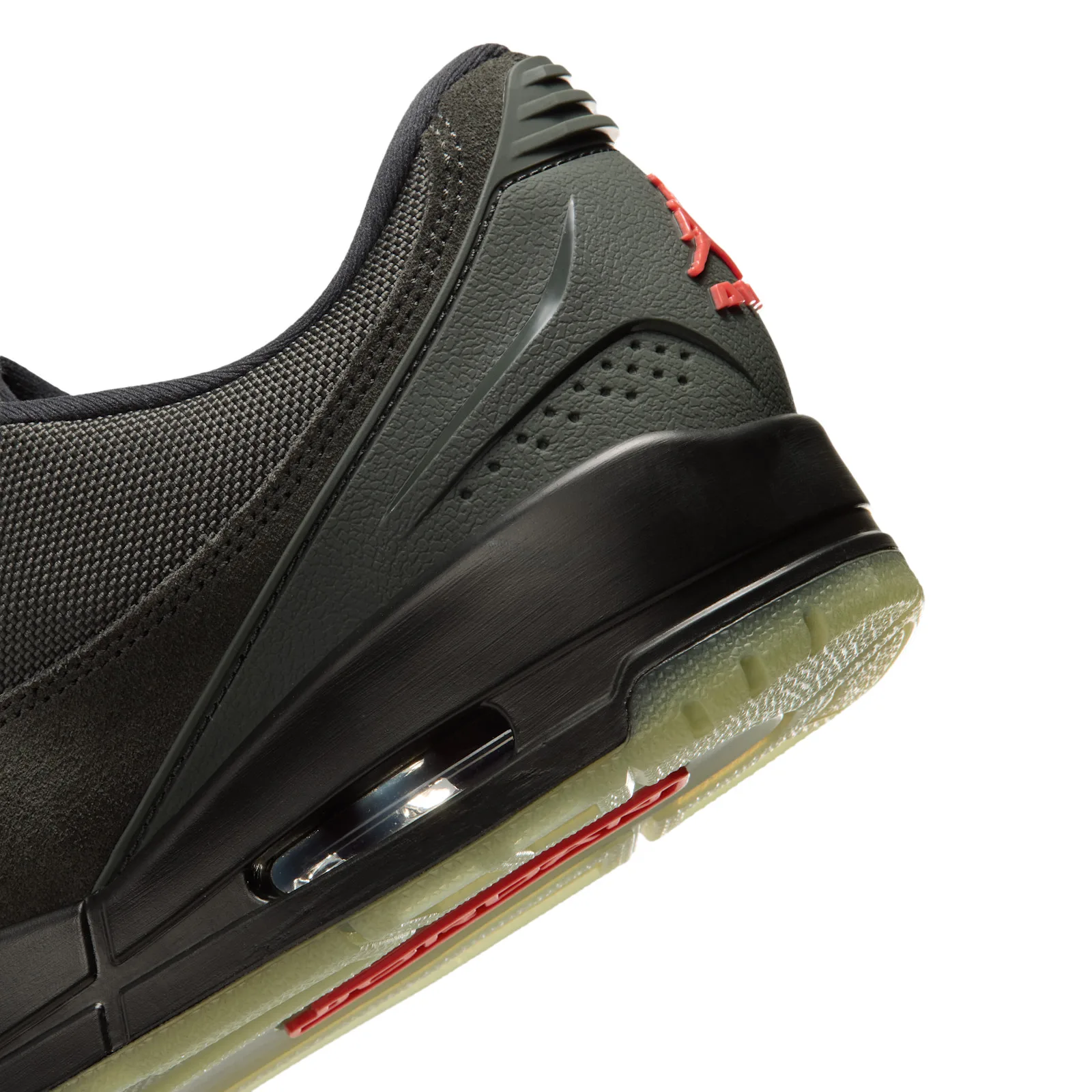 heel counter and outsole detail, translucent icy green sole, red Jumpman logo, Paris Saint Germain