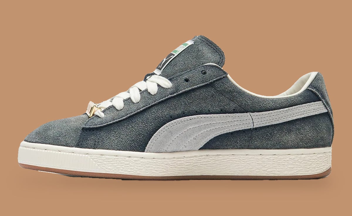 Medial view of worn blue-grey suede, pale grey stripe, cream laces and gum sole, Faded Blue