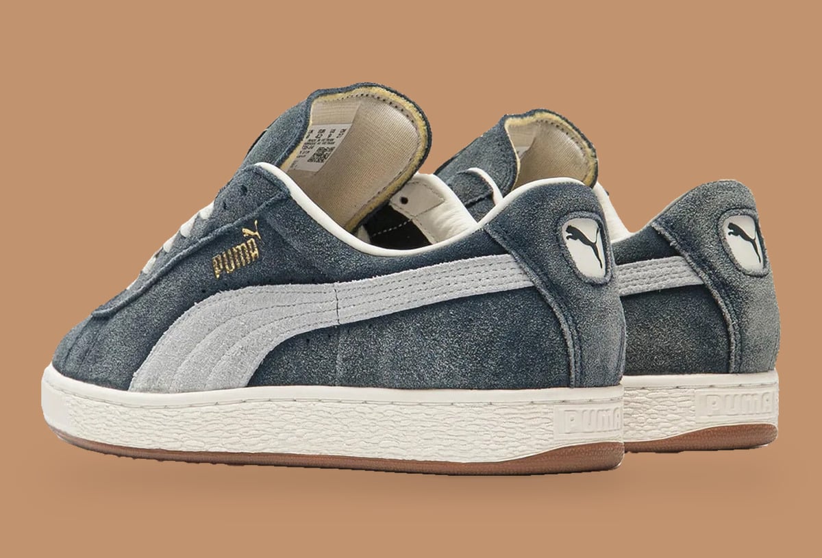 Pair from rear three-quarter, heel badges, pale grey formstripe and gum outsole edge, Faded Blue