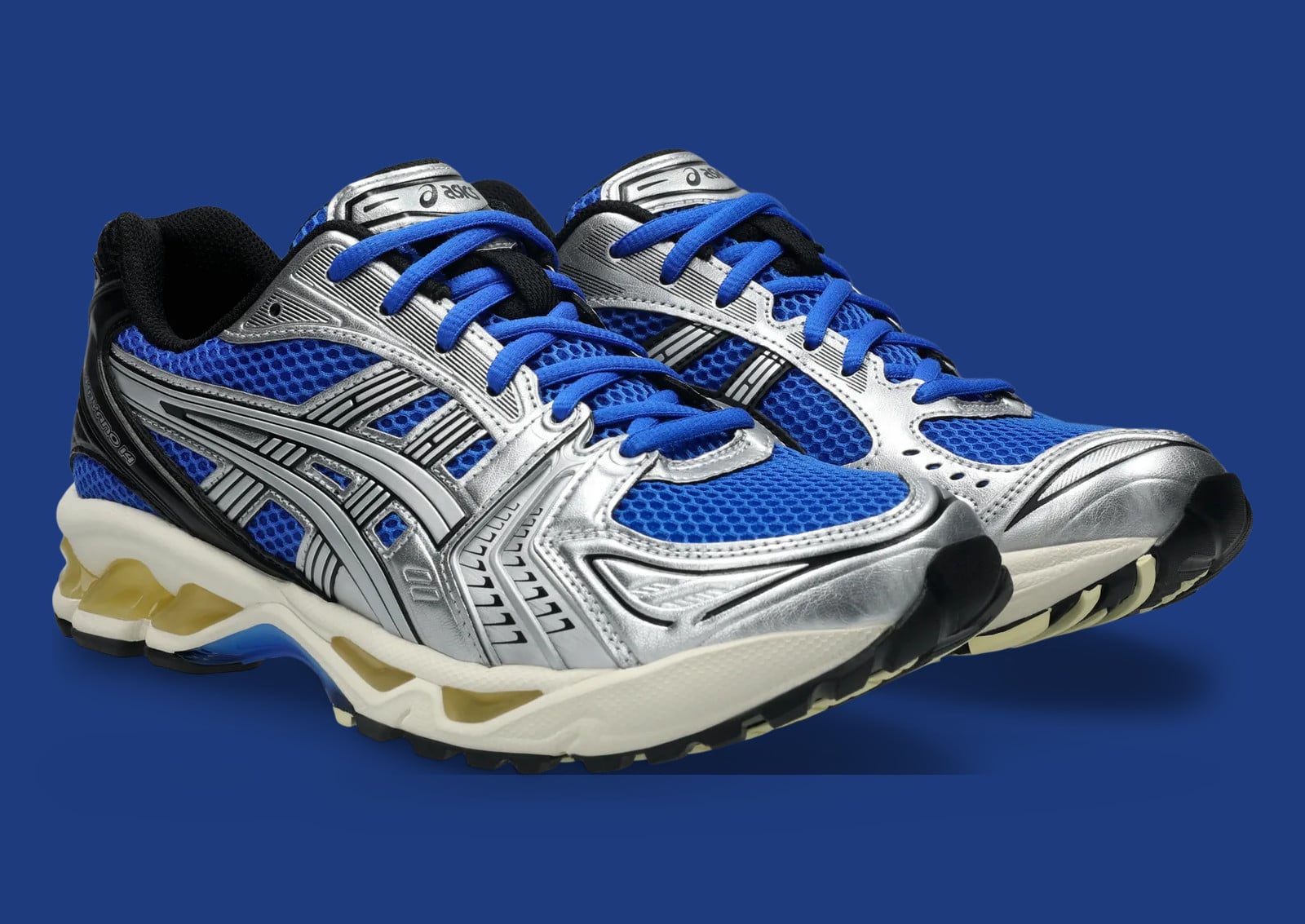 Pair, front three-quarter view with blue mesh, silver overlays and blue laces, ASICS GEL Kayano 14 “Illusion Blue”