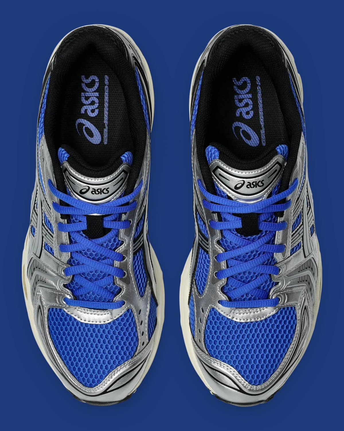 Top-down view of the pair with blue laces, silver overlays and asics insoles, Illusion Blue