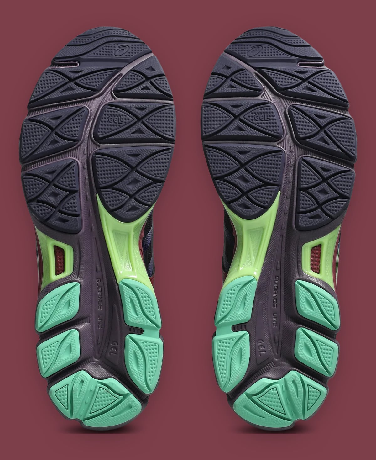 Outsole pair, navy tread with lime shank and mint heel pods, GEL text visible, x Kiko Kostadinov