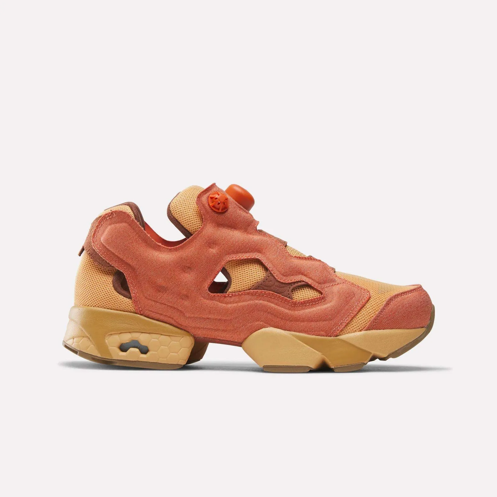 Lateral view on white, terracotta overlay, tan mesh, orange pump button, gum-tan sole, Aang