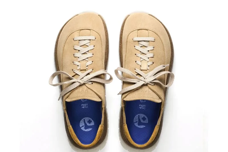 Top-down pair of tan suede lace-ups with cream laces, blue insoles and mustard heel tabs, Birkenstock 1774 Uerzell