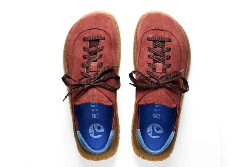 Top-down pair of rust-red suede lace-ups with brown laces and blue insoles with size 42, Birkenstock 1774 Uerzell