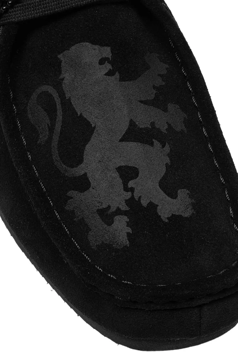 Detail of a tonal grey lion print on black suede vamp with contrast stitching, x Wasted Paris