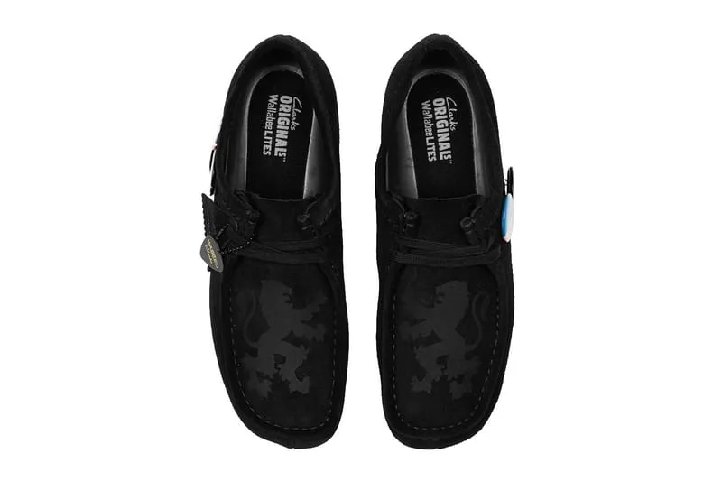 Top-down view of black suede pair with tonal lion print and Clarks Originals insole text, x Wasted Paris